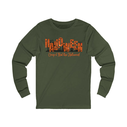 green unisex long sleeve t-shirt with halloween graphic of a cemetery and larger text "Halloween" and small text "Creep It Real This Halloween" by 515Gear.com 