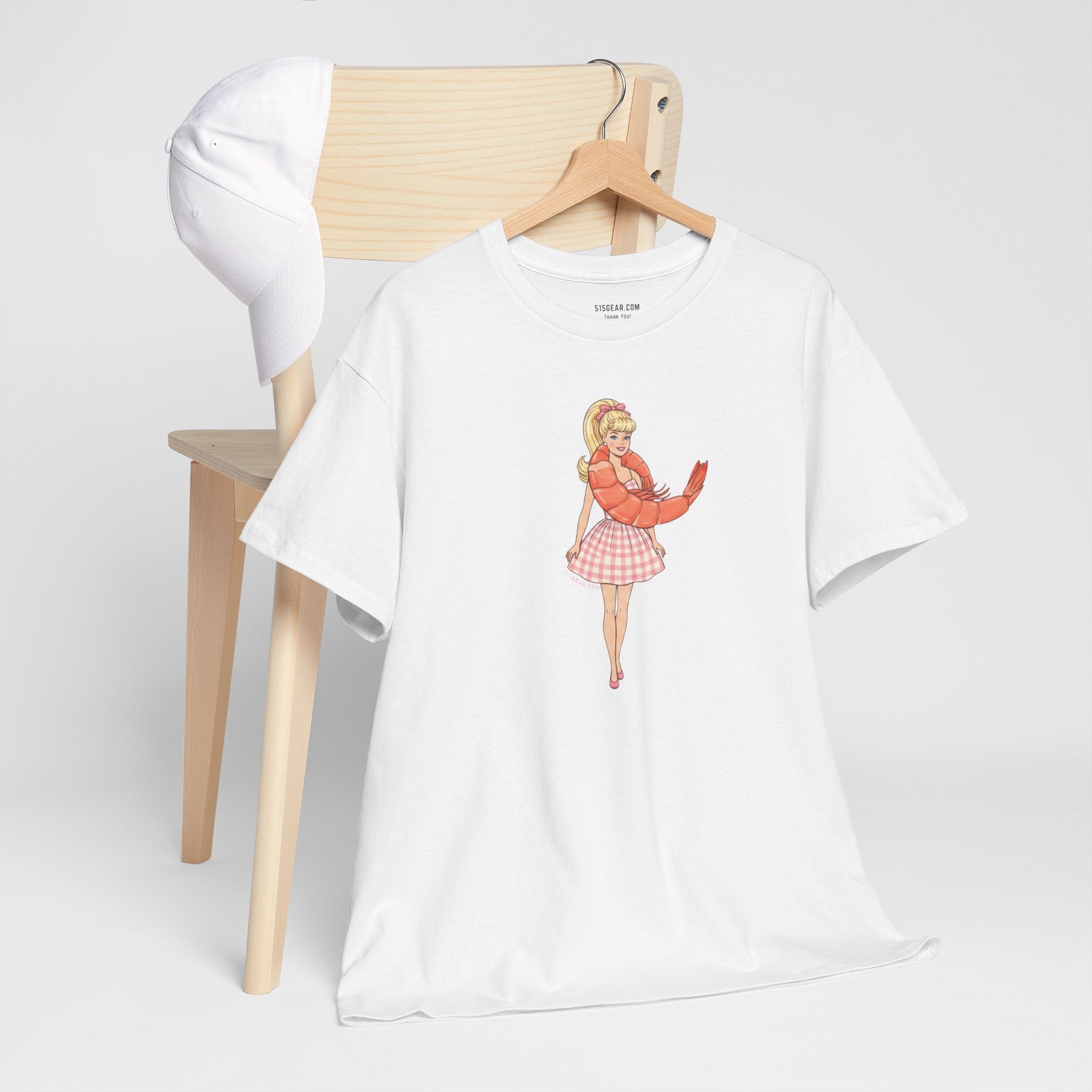White unisex Gildan 100% cotton tee with Barbie wearing a shrimp graphic as a "Shrimp on the Barbie" pun