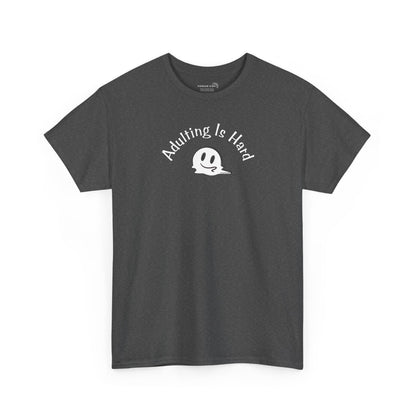 Gray Gildan Unisex 100% Heavy Cotton soft t-shirt, with smiley face graphic and text "Adulting is Hard"