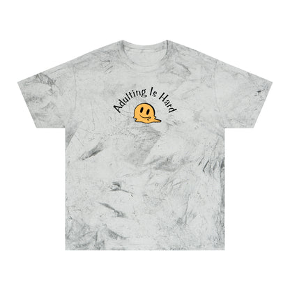 Marble-patterned gray Comfort Colors 1745 unisex color blast t-shirt, 100% ring-spun cotton, with melting smiley face and text "Adulting is Hard"