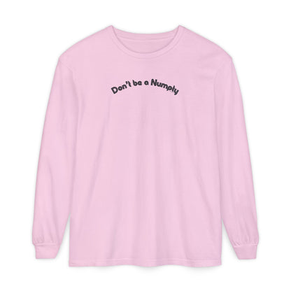 Pink long-sleeve shirt with text 'Don't be a Numpty' on a white background