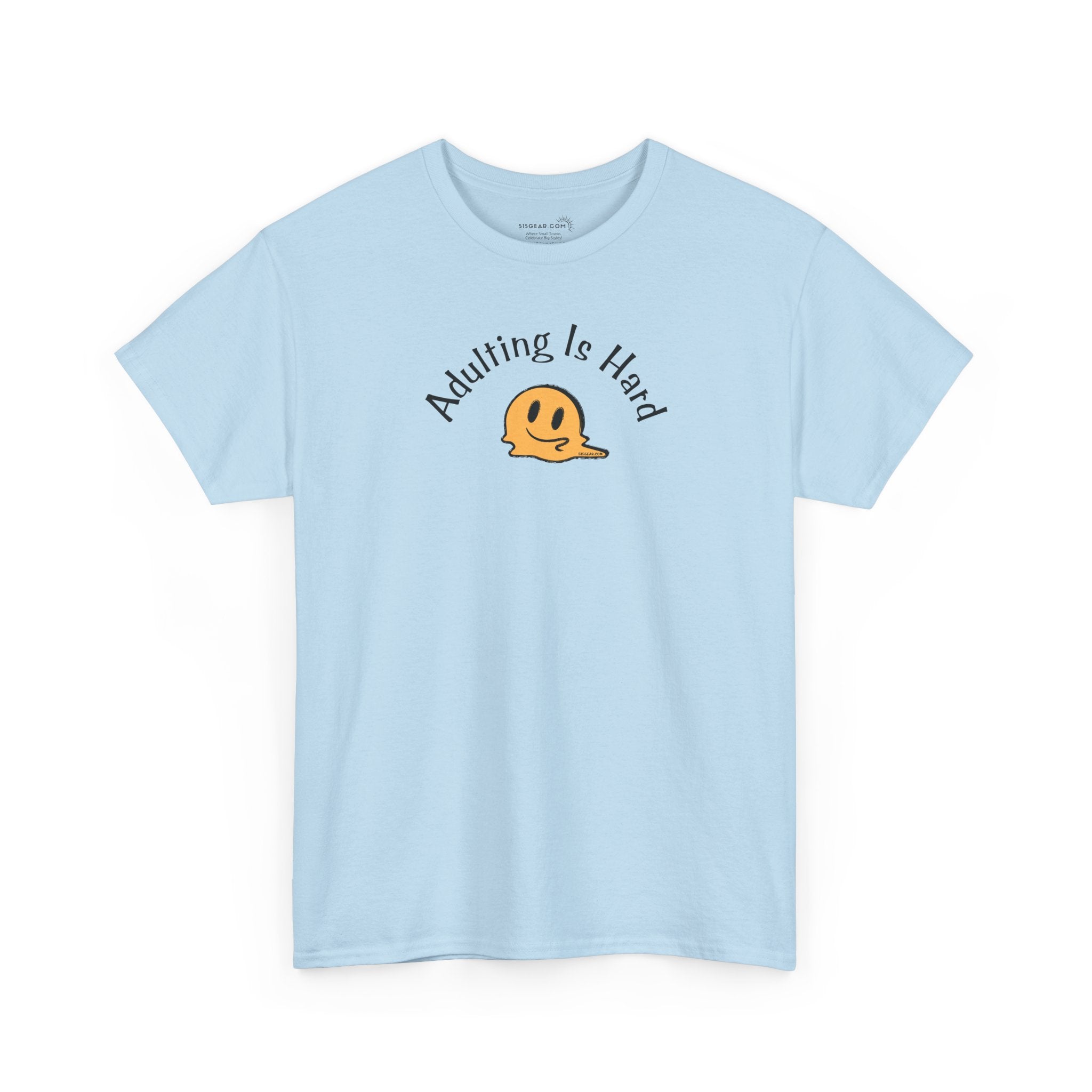 Light blue Gildan Unisex 100% Heavy Cotton soft t-shirt, with smiley face graphic and text "Adulting is Hard"