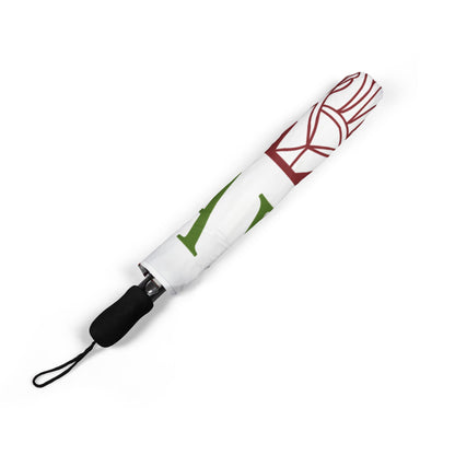 White umbrella with red and green designs on a white background