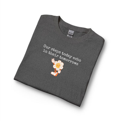 Folded dark gray long sleeve t-shirt with a sunflower design and text "our steps today echo in their tomorrows"