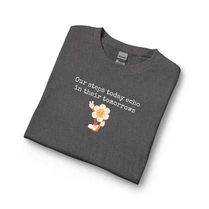 Folded dark gray long sleeve t-shirt with a sunflower design and text "our steps today echo in their tomorrows"