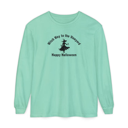 Mint long-sleeve unisex comfort color t-shirt with halloween witch graphic holding a wine glass  and text "Witch Way to the Vineyard - Happy Halloween" 