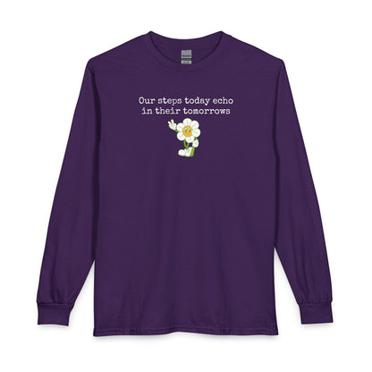 Purple long sleeve t-shirt with a sunflower design and text "our steps today echo in their tomorrows"